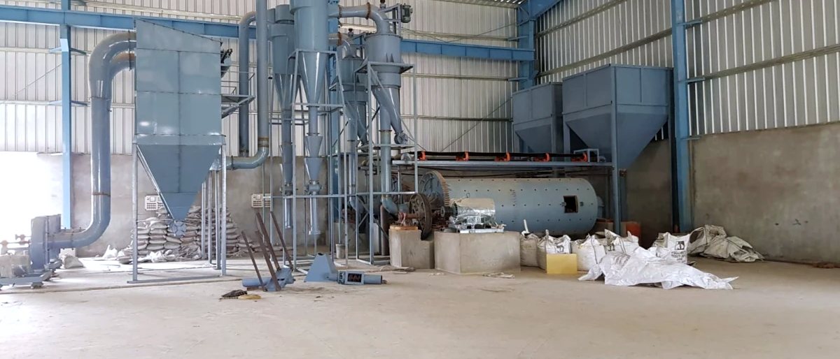 Micronizer plant with its air ducting run overhead and bagged product below
