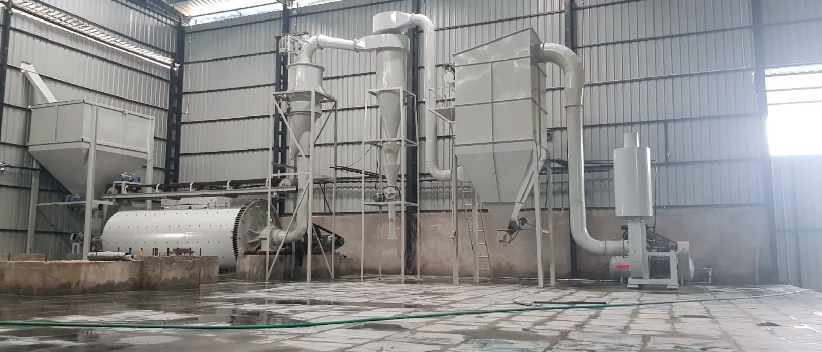 Micronizer plant installed in the works: mill drum at left, classifier, cyclones and bag filter along the bay